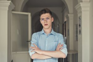 Teenager With Arms Cross Not Happy To See Parent