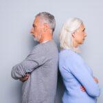 Older Couple With Backs Turned About To Experience Gray Divorce