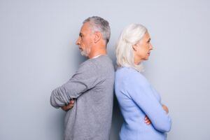 Older Couple With Backs Turned About To Experience Gray Divorce