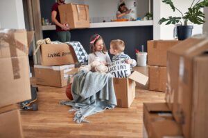 Children Near Boxes Relocating With Parents